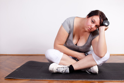 Plus size woman is fed up and tired of exercising